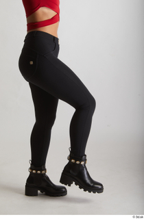  Zuzu Sweet  1 black boots black trousers casual dressed flexing leg side view 0003.jpg